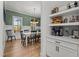 Inviting dining room showcases a stylish light fixture and convenient coffee bar area with floating shelves at 494 Terry Rd, Hillsborough, NC 27278