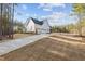 Spacious home on a large lot, featuring a long driveway and mature trees at 494 Terry Rd, Hillsborough, NC 27278