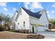 Beautiful two-story home featuring white siding, a two-car garage, and manicured landscaping at 494 Terry Rd, Hillsborough, NC 27278
