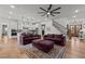 Spacious living room with two sofas, hardwood floors, and an open staircase at 494 Terry Rd, Hillsborough, NC 27278