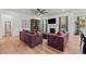 Spacious living room with a fireplace, bookshelf, modern furniture, and lots of natural light at 494 Terry Rd, Hillsborough, NC 27278