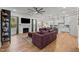 Cozy living room featuring hardwood floors, a fireplace, and an open-concept design at 494 Terry Rd, Hillsborough, NC 27278
