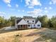 Picture of the back of the home showcasing its spacious screened-in porch, perfect for enjoying the outdoors at 494 Terry Rd, Hillsborough, NC 27278