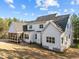 Image featuring the rear exterior of a two-story house, displaying a screened-in porch and windows at 494 Terry Rd, Hillsborough, NC 27278