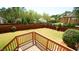 Beautifully landscaped backyard with a well-manicured lawn, wooden fence, and view from the deck at 504 Prince Dr, Holly Springs, NC 27540