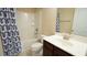 Bright bathroom with a shower and tub combination and a modern vanity at 504 Prince Dr, Holly Springs, NC 27540