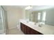 Bathroom with dual sink vanity, a large mirror, shower and soaking tub at 504 Prince Dr, Holly Springs, NC 27540