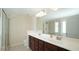Bathroom with dual sink vanity, a large mirror, shower and soaking tub at 504 Prince Dr, Holly Springs, NC 27540
