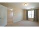 Bedroom featuring neutral walls and carpet, complemented by a window with curtains at 504 Prince Dr, Holly Springs, NC 27540