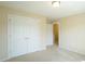Bedroom with carpet, closet, and neutral color at 504 Prince Dr, Holly Springs, NC 27540