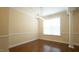 Formal dining space showcasing hardwood floors, and a modern rectangular lighting fixture at 504 Prince Dr, Holly Springs, NC 27540