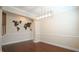 Dining room has decorative trim and a modern light fixture at 504 Prince Dr, Holly Springs, NC 27540