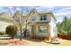 Charming two-story home featuring a welcoming front porch and beautifully landscaped yard at 504 Prince Dr, Holly Springs, NC 27540