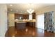 Modern kitchen with granite countertops, stainless steel appliances, and kitchen island at 504 Prince Dr, Holly Springs, NC 27540