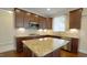 Kitchen featuring granite island, stainless steel appliances, and recessed lighting at 504 Prince Dr, Holly Springs, NC 27540