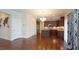 Open floor plan showing kitchen and dining area with hardwood floors at 504 Prince Dr, Holly Springs, NC 27540