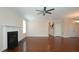 Open living room with hardwood floors, fireplace, and access to the foyer at 504 Prince Dr, Holly Springs, NC 27540