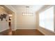 Bright room featuring hardwood floors, recessed lighting, and large windows at 504 Prince Dr, Holly Springs, NC 27540