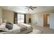 Spacious main bedroom with tray ceiling, large windows, and ensuite bathroom at 504 Prince Dr, Holly Springs, NC 27540