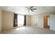 Spacious main bedroom featuring neutral color palette, a ceiling fan, and lots of natural light at 504 Prince Dr, Holly Springs, NC 27540