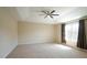 Spacious main bedroom with tray ceiling and large window at 504 Prince Dr, Holly Springs, NC 27540