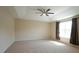 Spacious main bedroom with tray ceiling and large window at 504 Prince Dr, Holly Springs, NC 27540