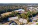 Expansive aerial view of community courts, school, and neighborhood amidst fall foliage at 507 Parkside Cir, Chapel Hill, NC 27516
