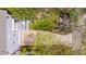 Aerial view of backyard, deck, driveway, and landscaping at 507 Parkside Cir, Chapel Hill, NC 27516