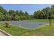 Community basketball court surrounded by lush greenery, perfect for outdoor activities at 507 Parkside Cir, Chapel Hill, NC 27516