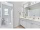 Bright bathroom boasts double vanity, toilet room, and ample natural light at 507 Parkside Cir, Chapel Hill, NC 27516