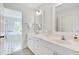 Bathroom featuring double vanity, tub, and a view of the outside at 507 Parkside Cir, Chapel Hill, NC 27516