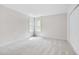 Bedroom with neutral carpet and walls, three windows, and natural light at 507 Parkside Cir, Chapel Hill, NC 27516