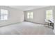 Spacious bedroom with ample natural light from multiple windows and a clean, neutral design at 507 Parkside Cir, Chapel Hill, NC 27516