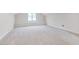 Bright and spacious bonus room featuring a window seat and neutral carpet at 507 Parkside Cir, Chapel Hill, NC 27516