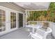 Exterior view of a deck with comfortable seating and lush greenery at 507 Parkside Cir, Chapel Hill, NC 27516