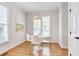 Sunlit dining area with a modern round table, stylish chairs, and large windows at 507 Parkside Cir, Chapel Hill, NC 27516