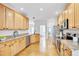 Bright kitchen featuring light wood cabinets, stainless steel appliances, and granite countertops at 507 Parkside Cir, Chapel Hill, NC 27516