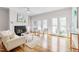 Cozy living room featuring a fireplace, hardwood floors, and a bright, open atmosphere at 507 Parkside Cir, Chapel Hill, NC 27516