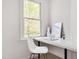 Cozy study nook with a sleek white desk and large window offering natural light at 507 Parkside Cir, Chapel Hill, NC 27516
