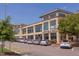 A modern commercial building with large windows, housing the 