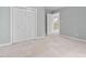 Bedroom with carpet flooring and view of upstairs hallway at 537 Chatham Dr, Chapel Hill, NC 27516