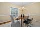 Well-lit dining room featuring modern decor and views of the backyard at 537 Chatham Dr, Chapel Hill, NC 27516