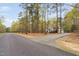 Charming home nestled among mature trees, boasting a long driveway and peaceful setting at 537 Chatham Dr, Chapel Hill, NC 27516
