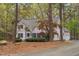 Inviting two-story home features a well-manicured front yard and a classic architectural style at 537 Chatham Dr, Chapel Hill, NC 27516