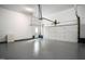 Open garage space with clean floors and white walls, ready for parking and storage at 537 Chatham Dr, Chapel Hill, NC 27516