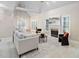 Bright living room featuring a fireplace, hardwood floors, and comfortable seating at 537 Chatham Dr, Chapel Hill, NC 27516