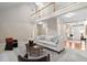 Spacious living room with a soaring ceiling, second story overlook and stylish decor at 537 Chatham Dr, Chapel Hill, NC 27516