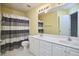Bathroom with double sink vanity, tub and shower combination with curtain at 5612 Crossfield Dr, Raleigh, NC 27613