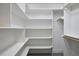 Walk-in closet with multiple shelves for optimal storage and organization at 5612 Crossfield Dr, Raleigh, NC 27613