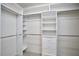 Spacious walk-in closet with custom shelving and drawers for maximum storage and organization at 5612 Crossfield Dr, Raleigh, NC 27613